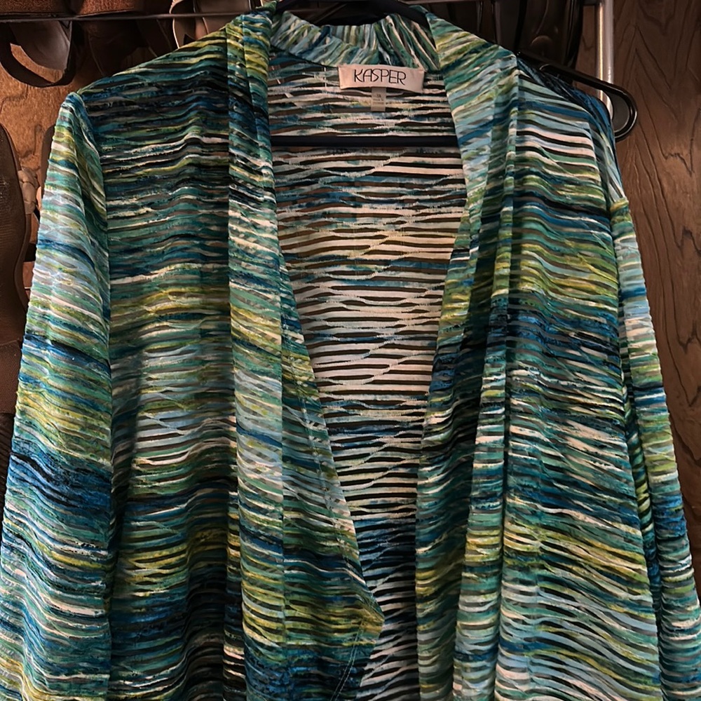 Cute light weight jacket. It’s shear. Non smoking home.